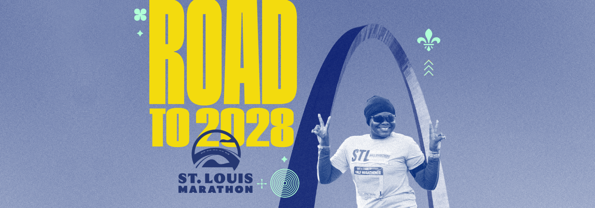 Bold yellow text 'ROAD TO 2028' with a smiling runner posing beside a surfboard and the St. Louis Marathon logo in blue on a blue background, promotional banner.