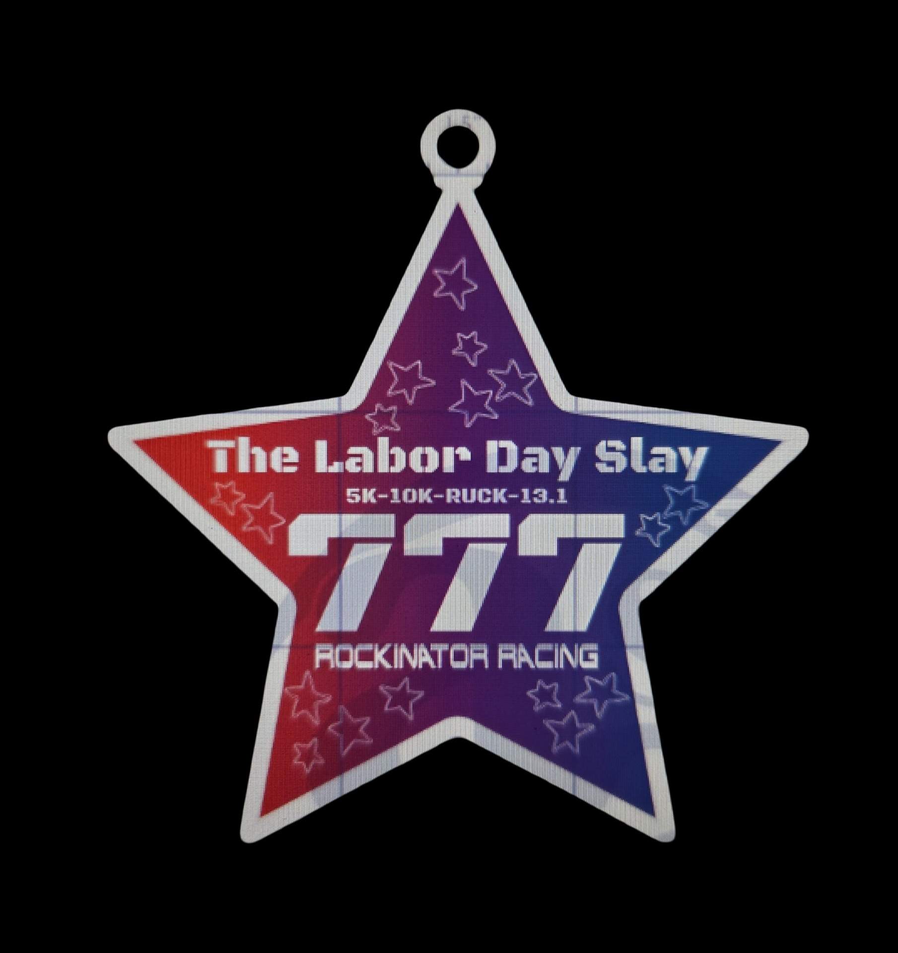 Triangular patriotic race badge with white border, purple center, stars, and text about 'The Labor Day Slay' event (5K-10K-RUCK-13.1).