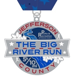 Medal featuring a banner that reads 'The Big River Run' with 'Jefferson County' around a blue river graphic and 5K/10K mile markers, stylized with stars and laurel leaves